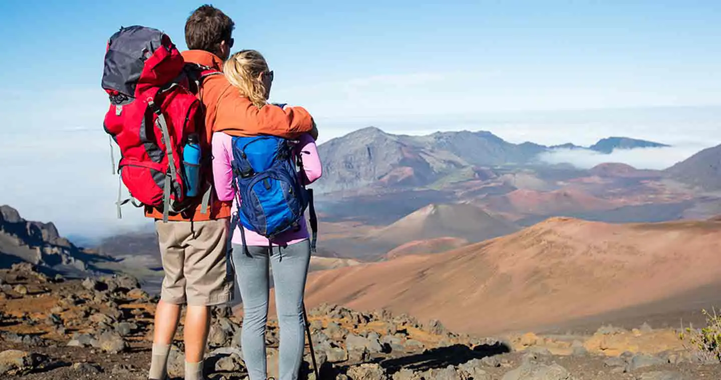 Hiking couple enjoying the view at the end of their hike