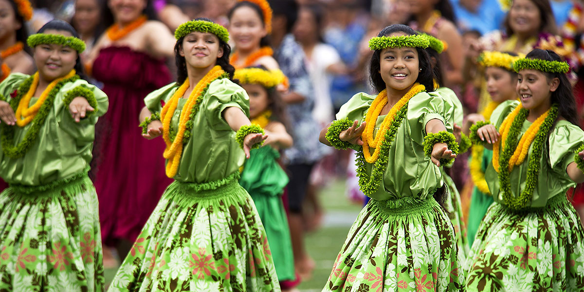A group of girls showcasing Hawaiian culture by dancing Hula.