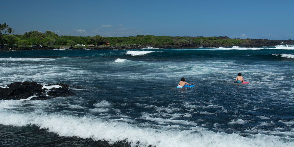 Big Island surfing at Punalu'u Black Sand Beach