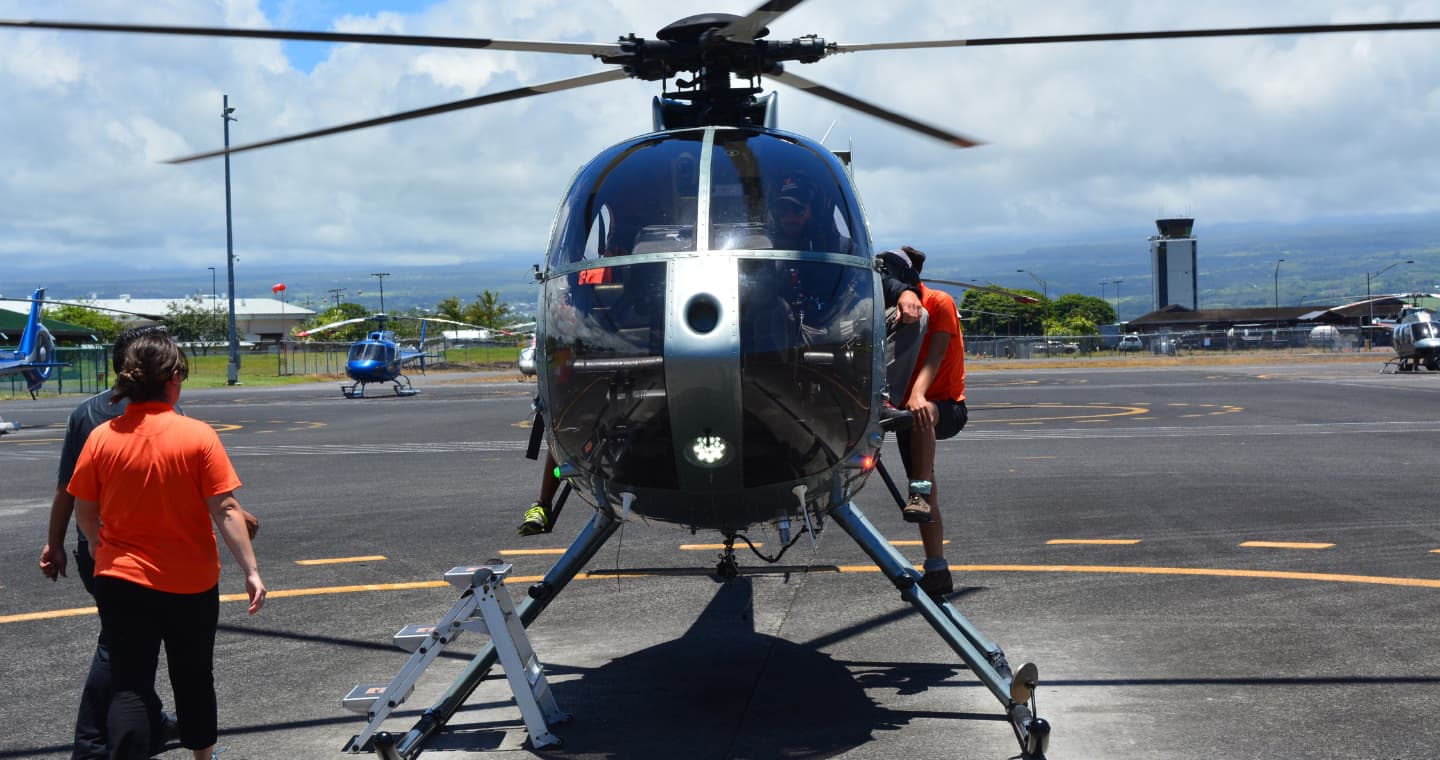 Boarding an helicopter at Big Island for a tour. Don't miss this extraordinary experience when you visit our Volcano B&B.
