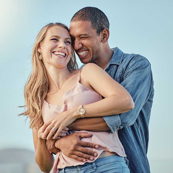 Couple embracing outside