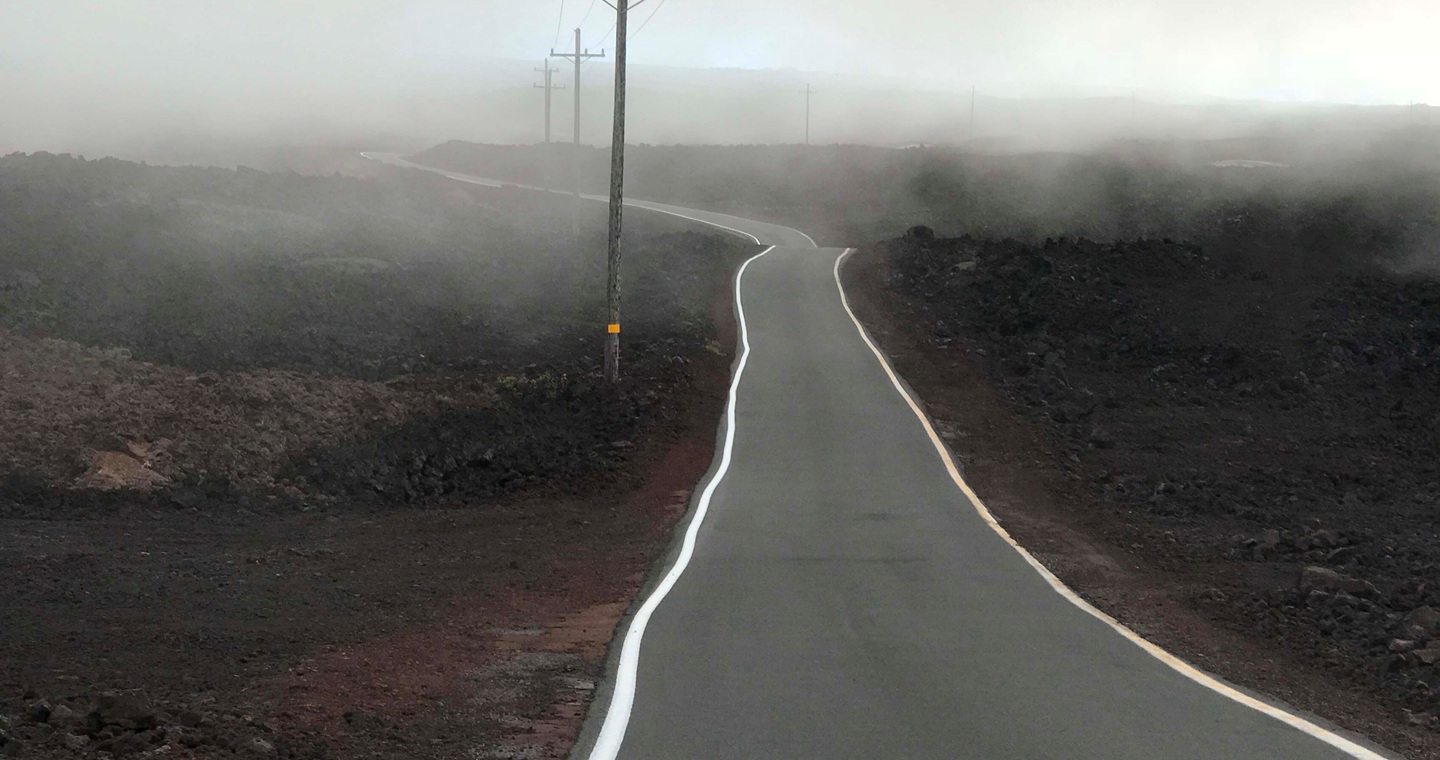 Foggy road leading up to Mauna Loa in Hawaii