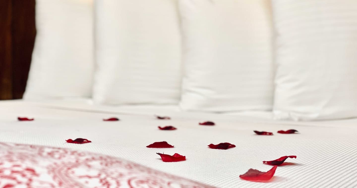rose petals covering a bed at Volcano Village Estates in Hawaii