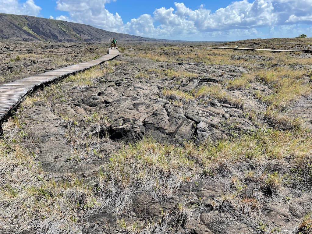 A wooden boardwalk in the Pu‘uloa Petroglyphs field at Hawaii Volcanoes National Park
